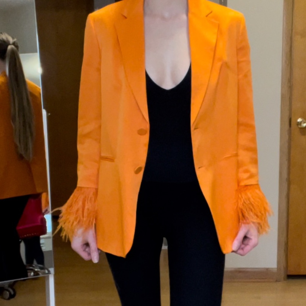 Orange Satin Zara blazer with feather trim wrists.